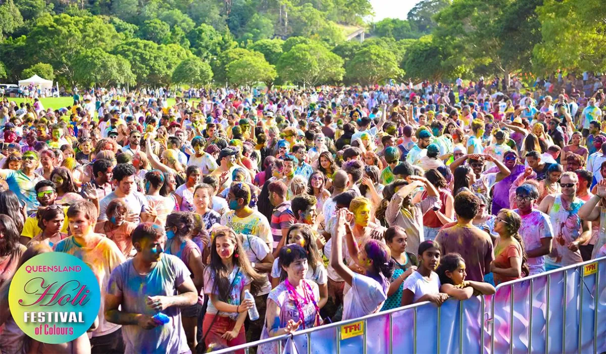 people dancing at holi