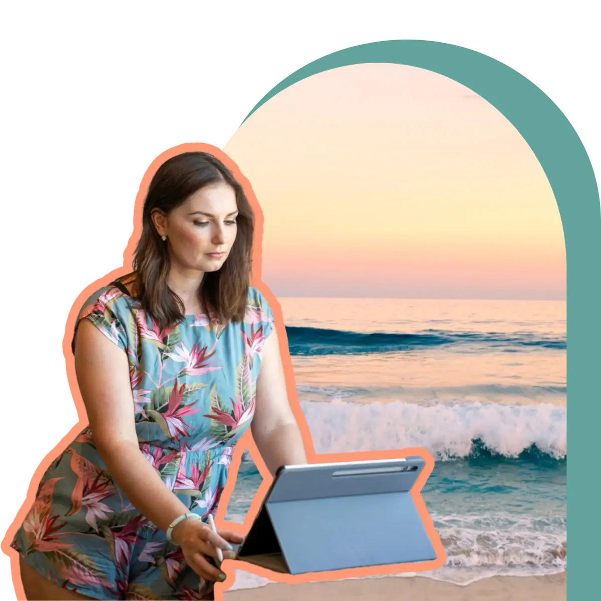 Corryn, owner of La Vida Design, working on a tablet by the ocean, reviewing designs with a beach sunset in the background.