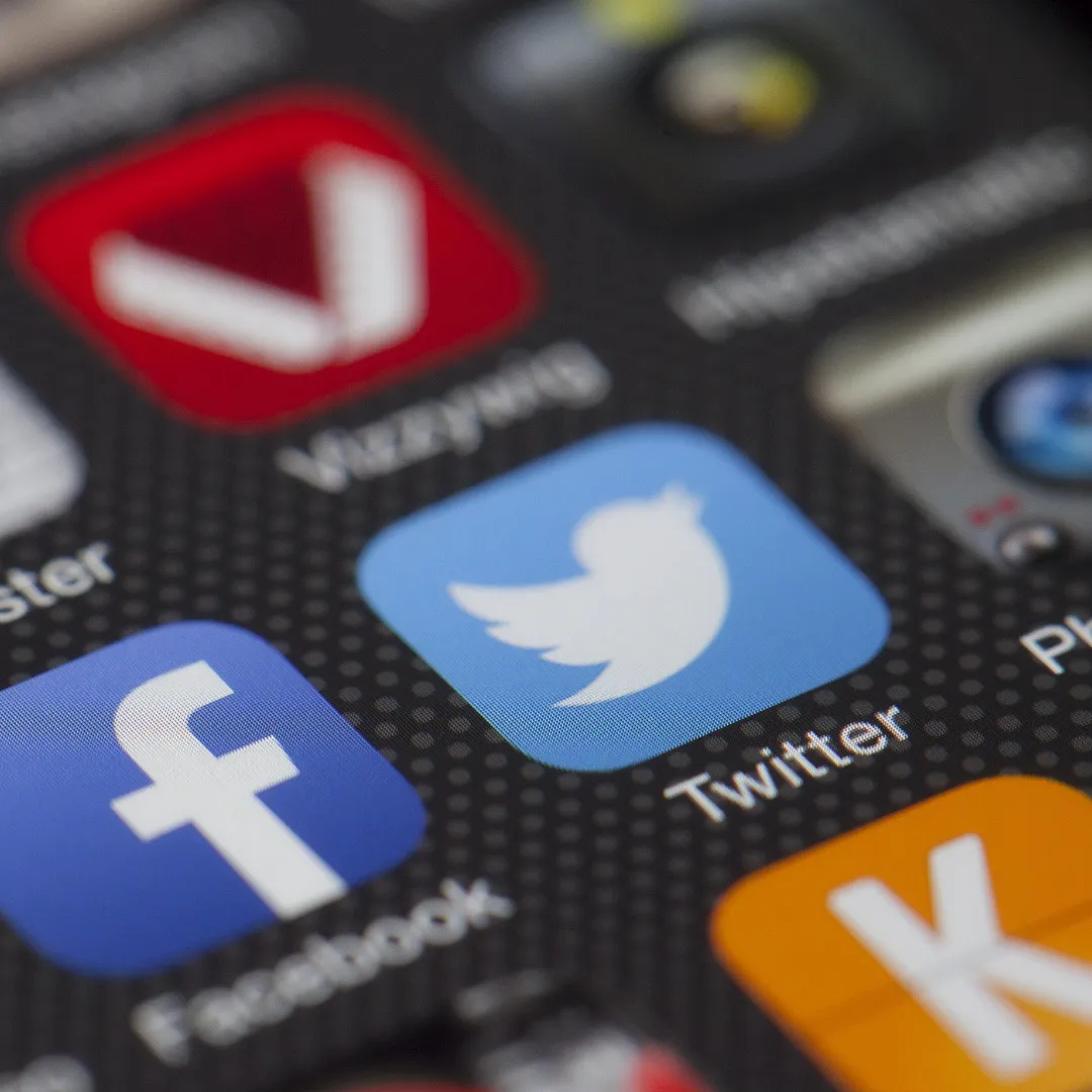 Social media platform icons on a phone screen