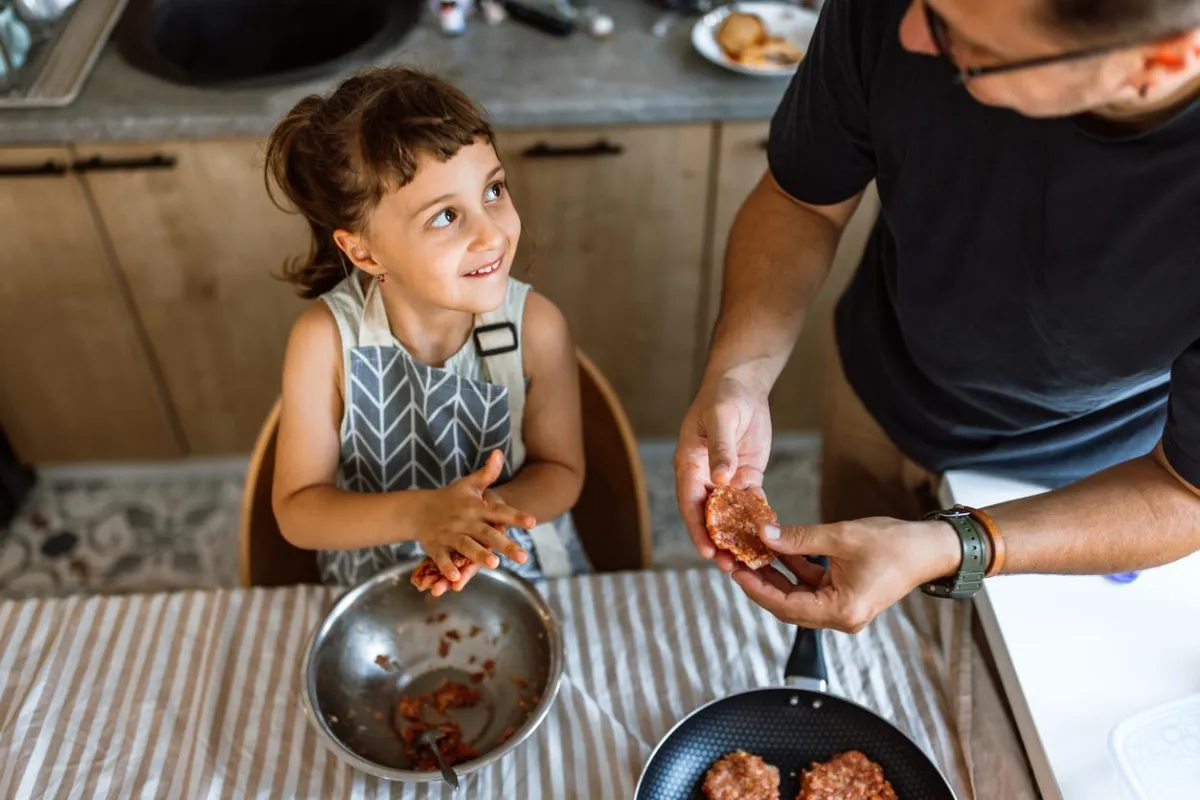 A gentle hand rests on another's palm.