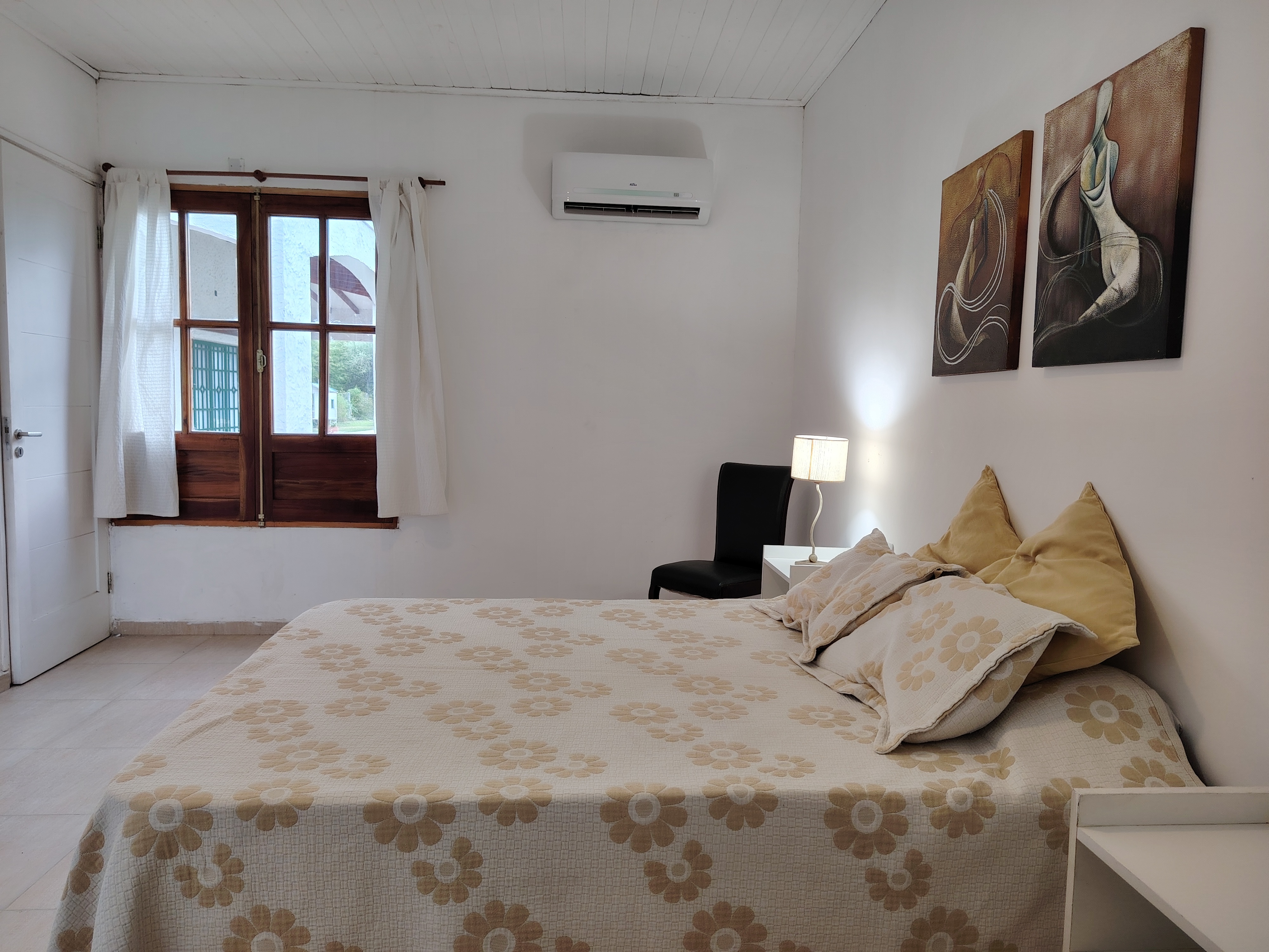 a modern house with a walkway leading to the front door