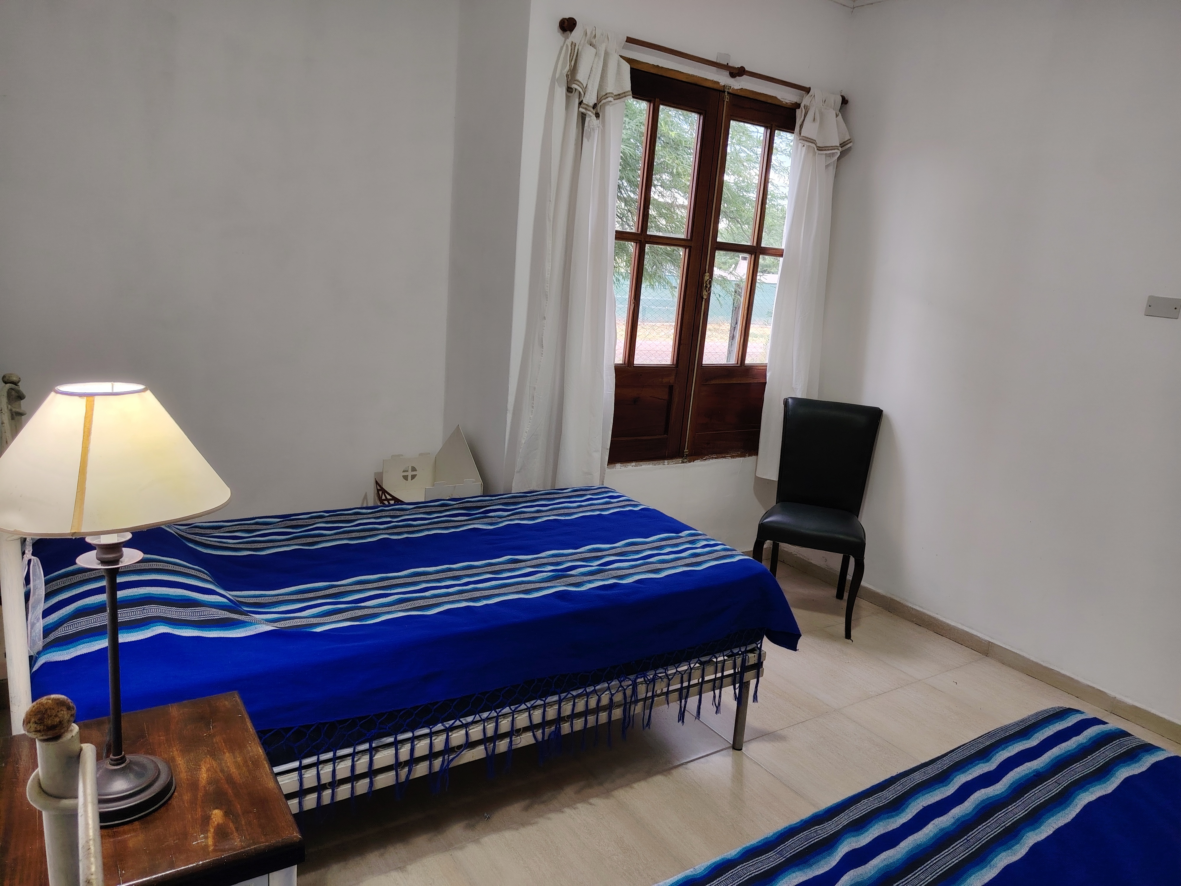 a modern house with a walkway leading to the front door