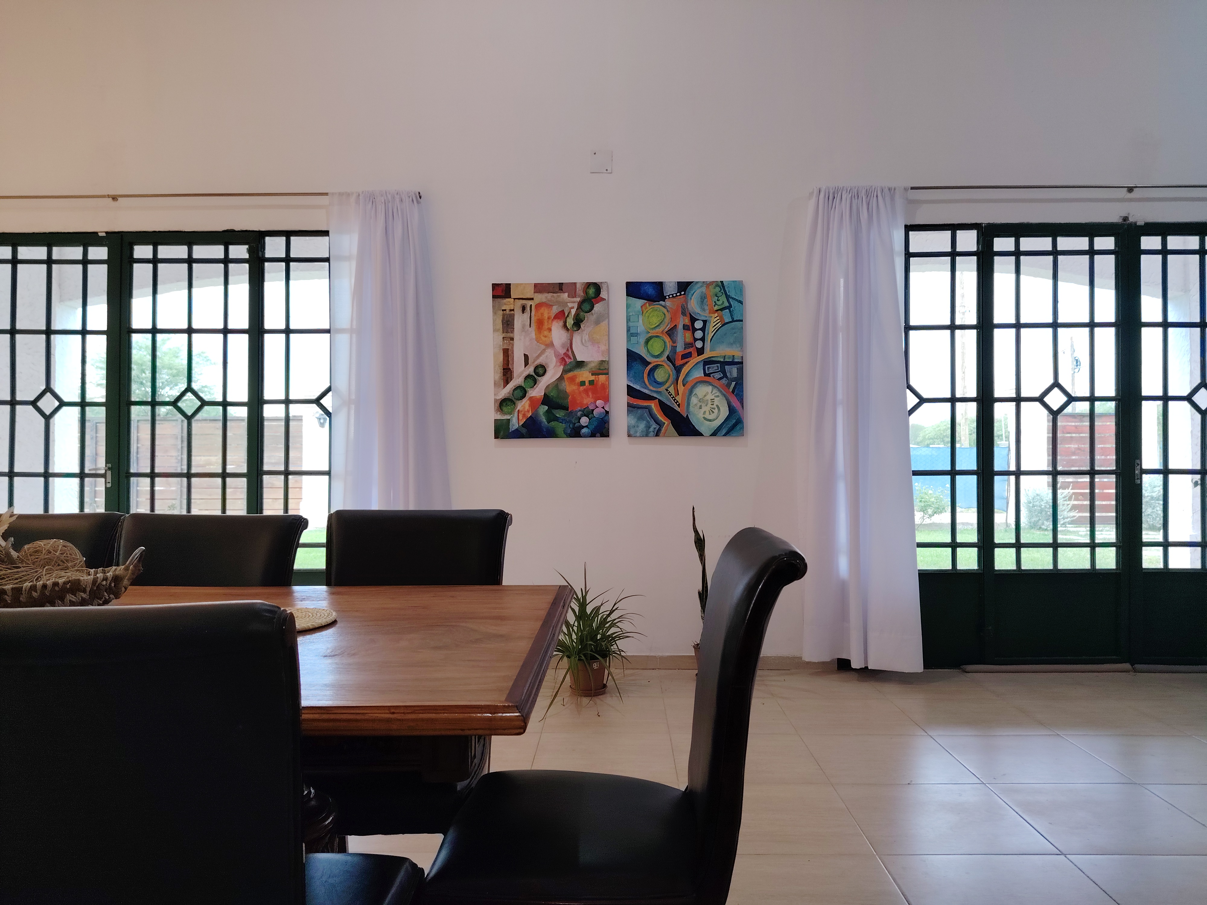 a modern house with a walkway leading to the front door