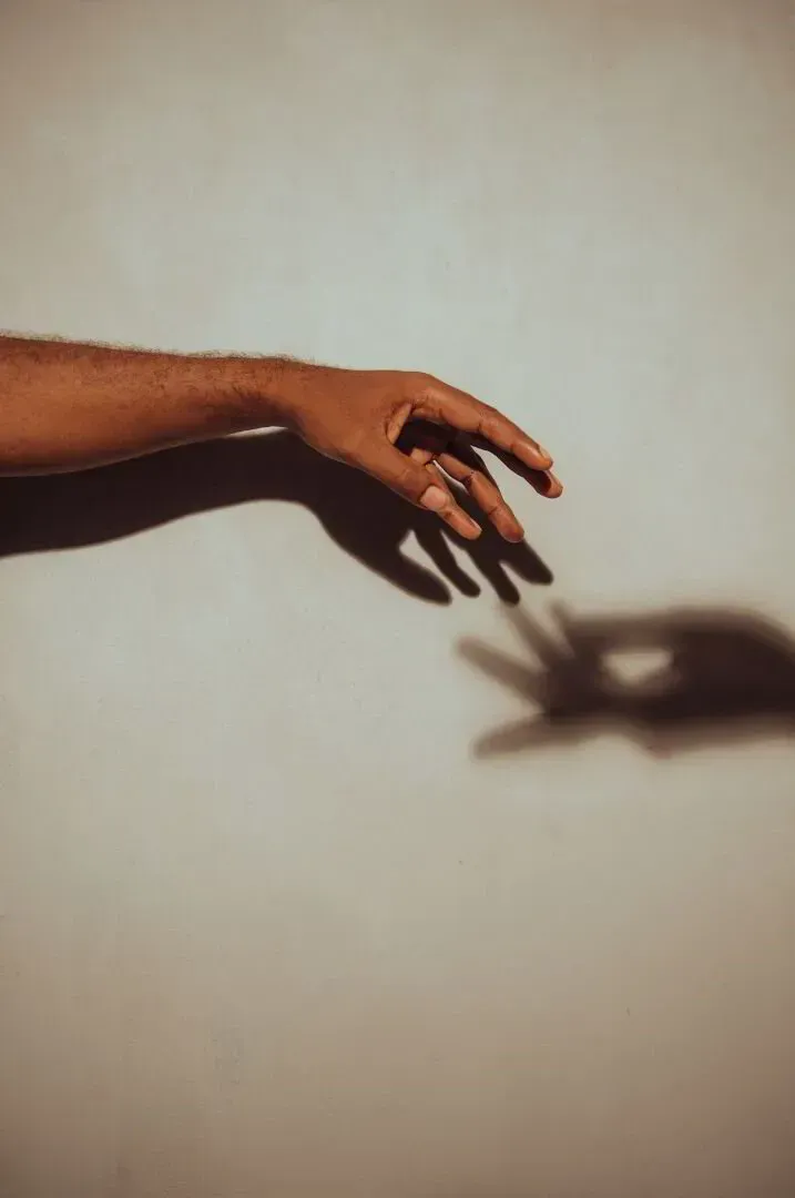 Hand reaching with shadow