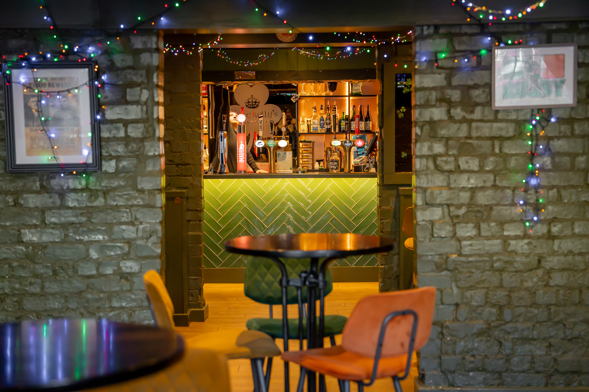 A group celebrating a special occasion with drinks at Grace Kelly's Irish Lounge