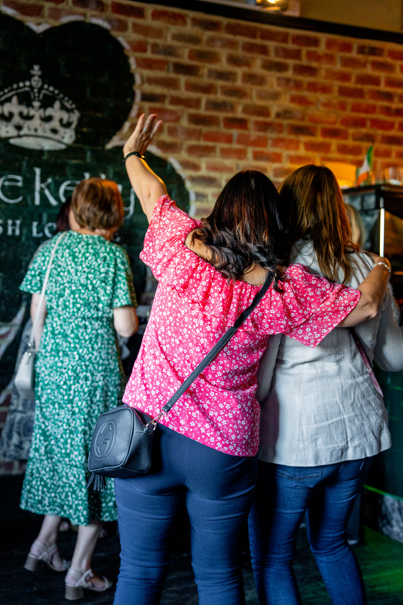 A group celebrating a special occasion with drinks at Grace Kelly's Irish Lounge