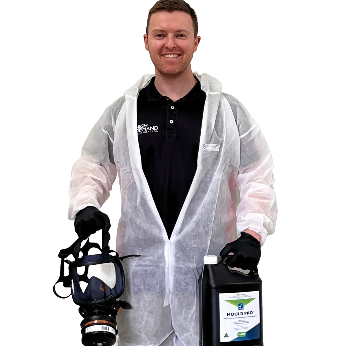 Technician in protective gear holding mould treatment equipment and disinfectant container