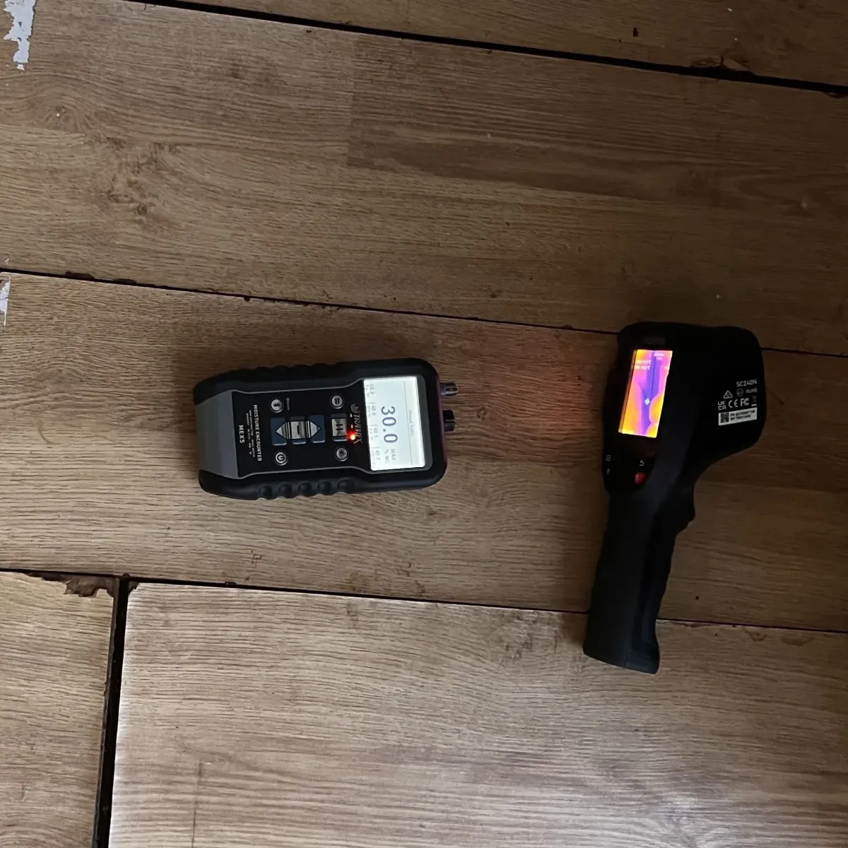 Moisture meter and thermal imaging camera used to detect hidden dampness in building materials