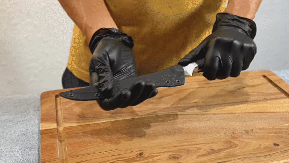 Filleting knife gliding through fish meat showing clean, precise cuts