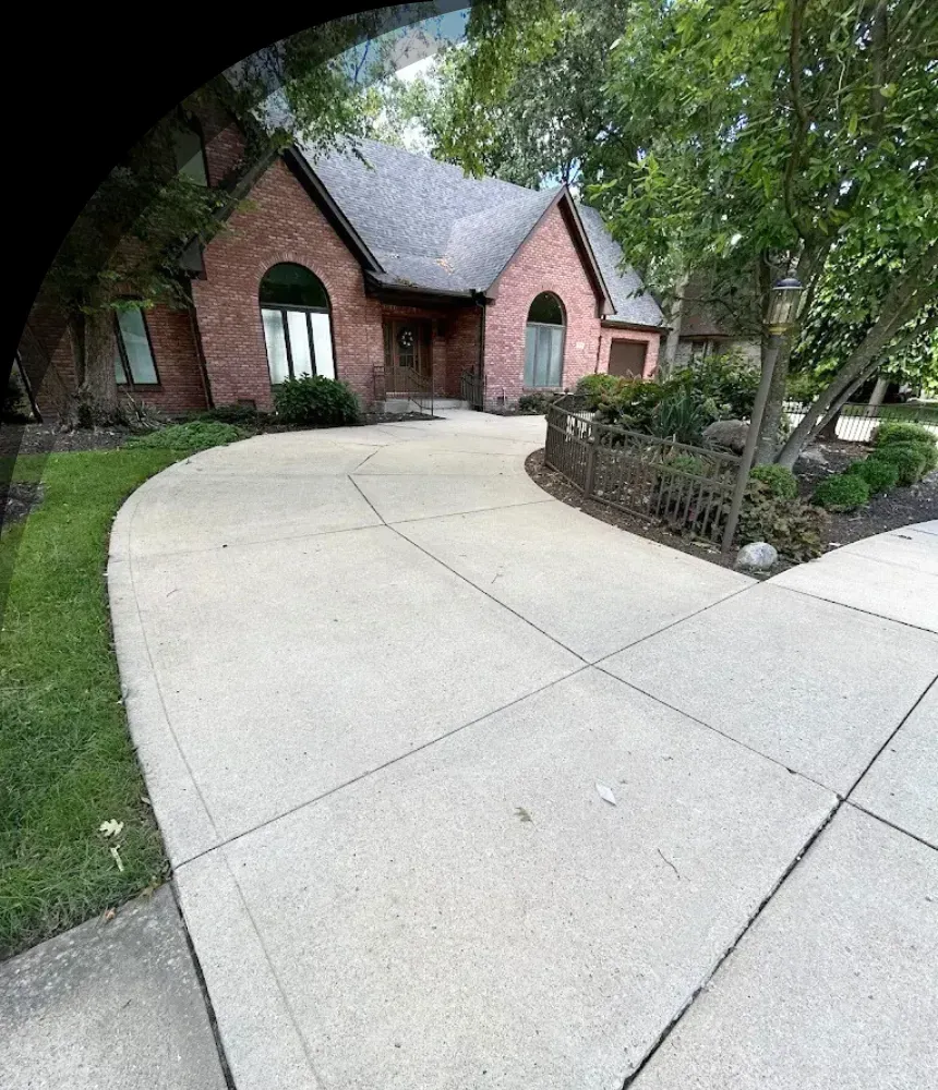 Clean concrete driveway after professional pressure washing in Indianapolis