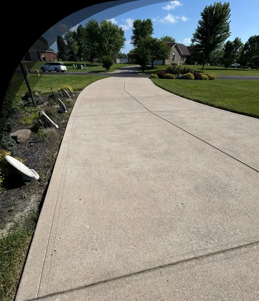Clean concrete driveway after professional pressure washing in Indianapolis