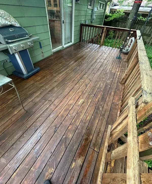 Freshly pressure washed wooden deck with natural finish