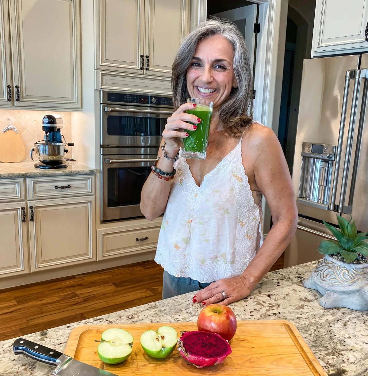 Karen Church - holistic health consultant preparing green juice