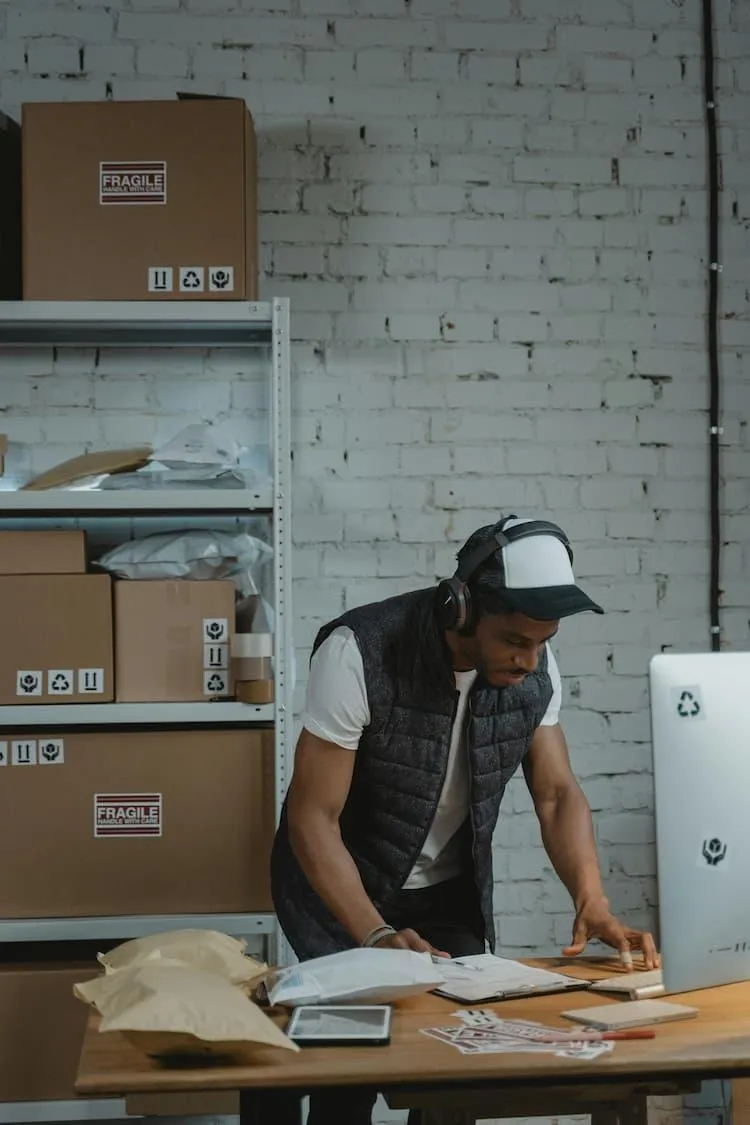 Immigrant man successfully working at a desk efficiently