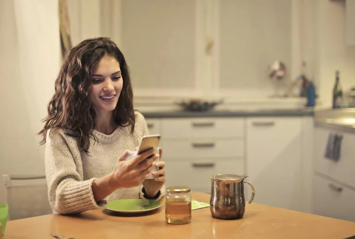 Immigrant woman smiles as she experiences improved social integration and economic mobility