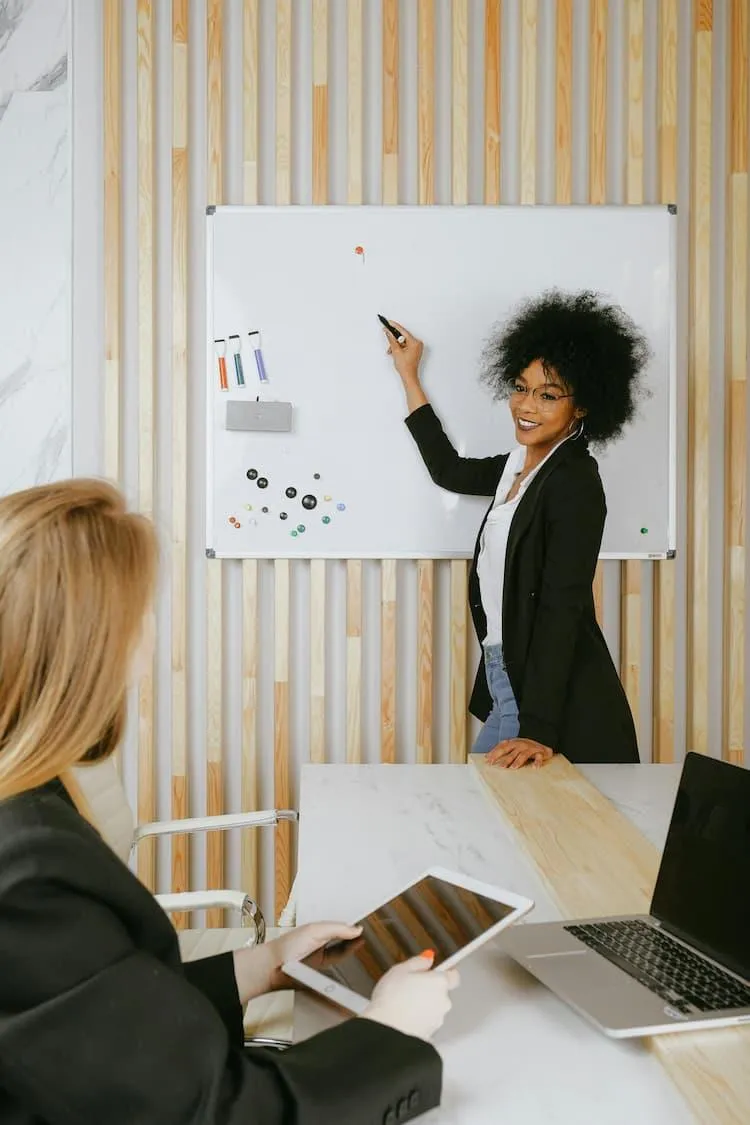 Refugee woman confidently is presenting at a business meeting