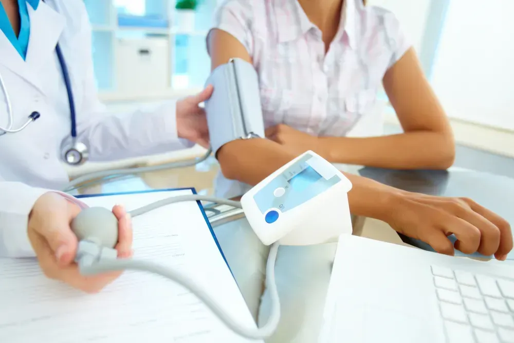 A close-up of medical instruments and a healthcare professional caring for a patient, representing long-term care for toxic exposure victims.