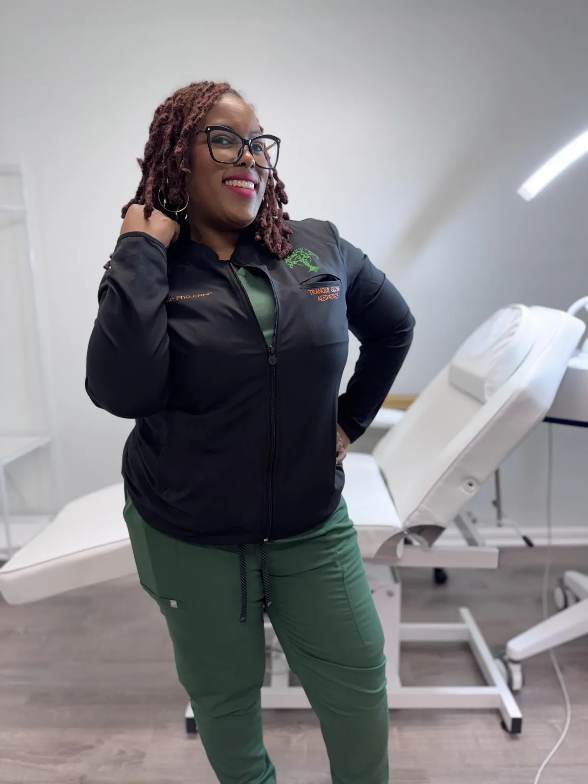 Dr. Pate in treatment room dressed in green