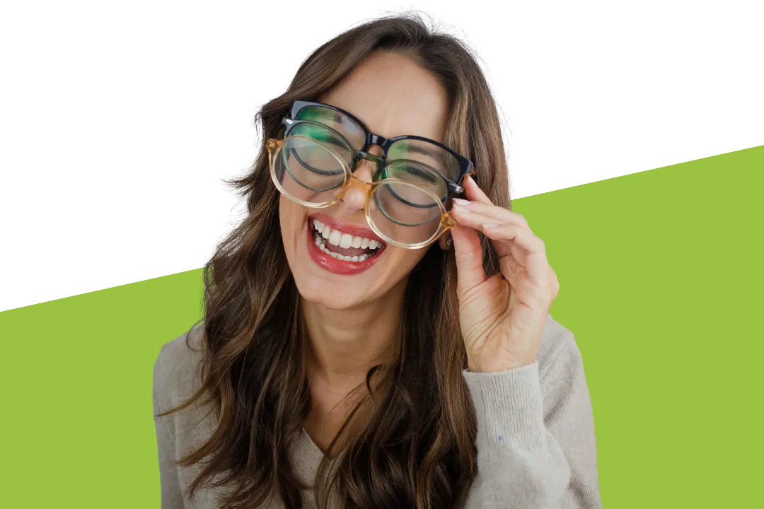 a pair of glasses sitting on top of a white box