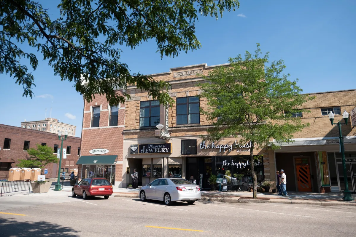 Restored front porch with modern railings in Downtown Grand Island