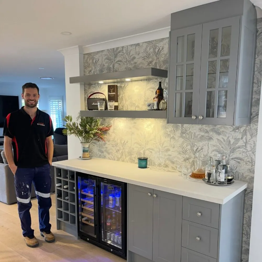 A kitchen with a center island and a refrigerator