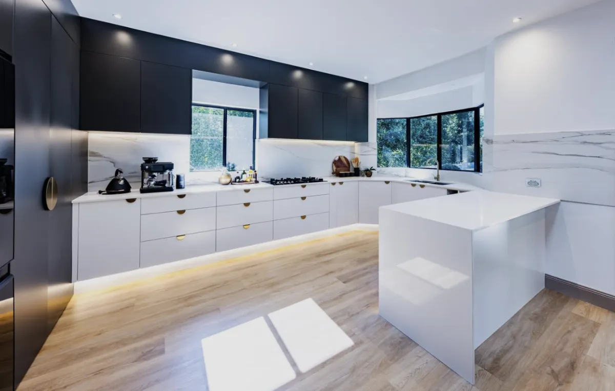 a kitchen with black cabinets
