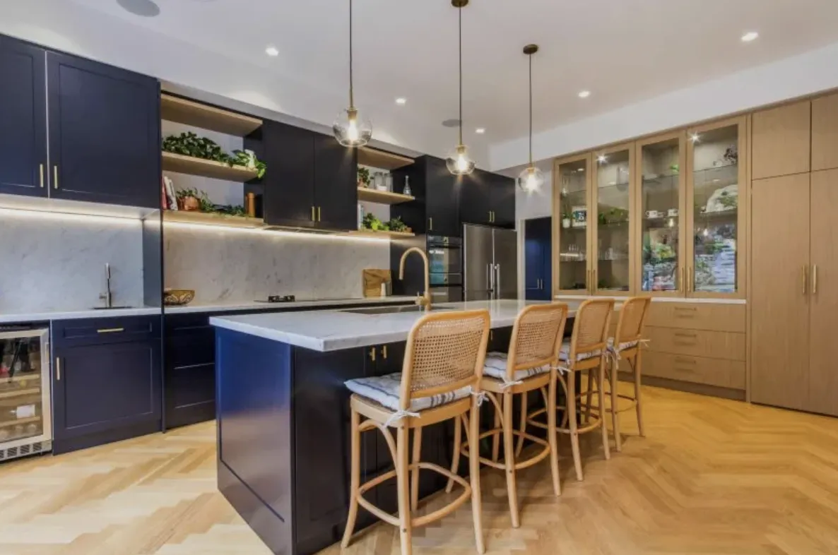 a kitchen with black cabinets