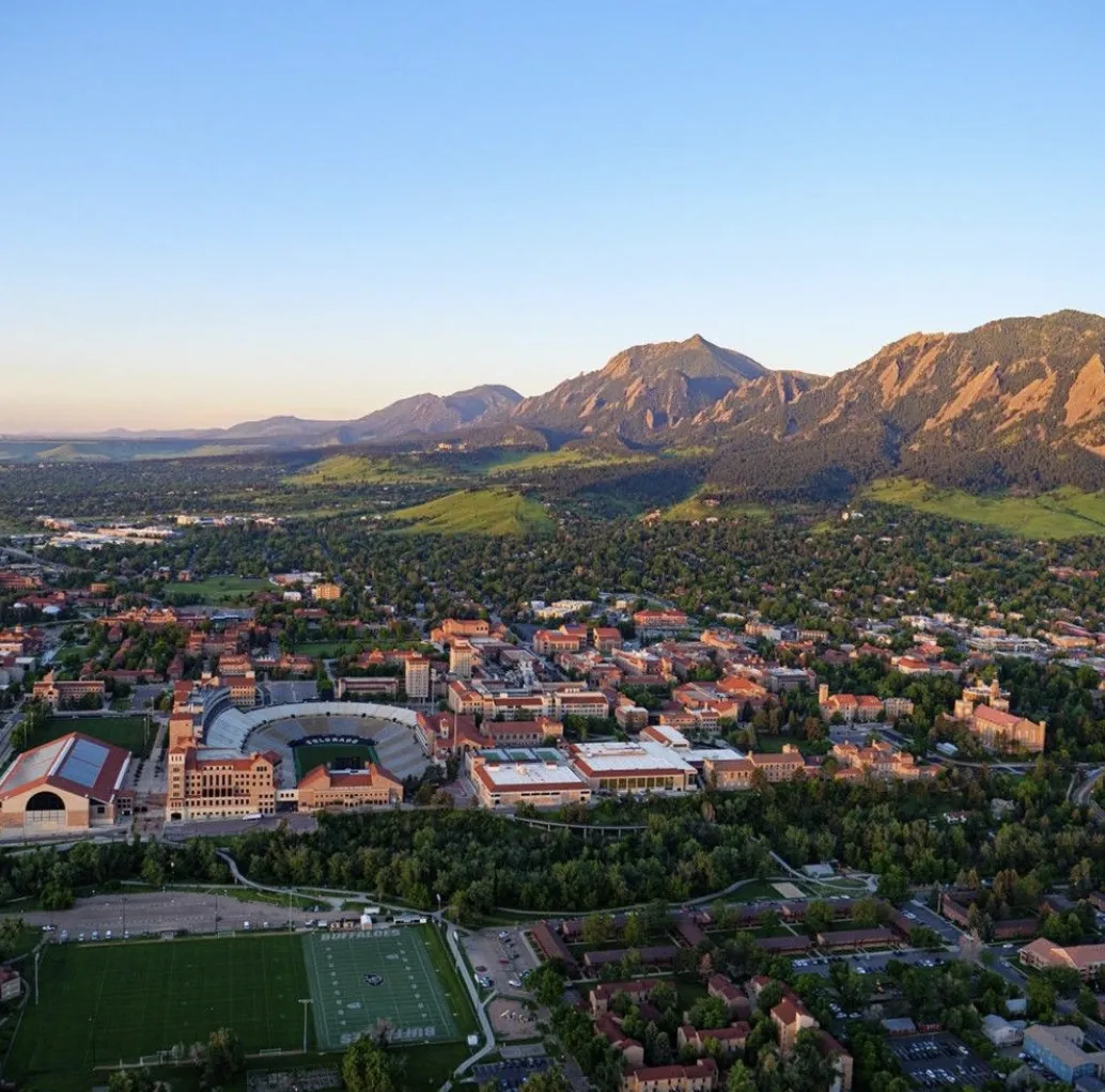 Diverse team of financial professionals standing together in a bright office, smiling confidently. The group includes men and women of various ages and backgrounds, dressed in business attire, with a welcoming and collaborative atmosphere.