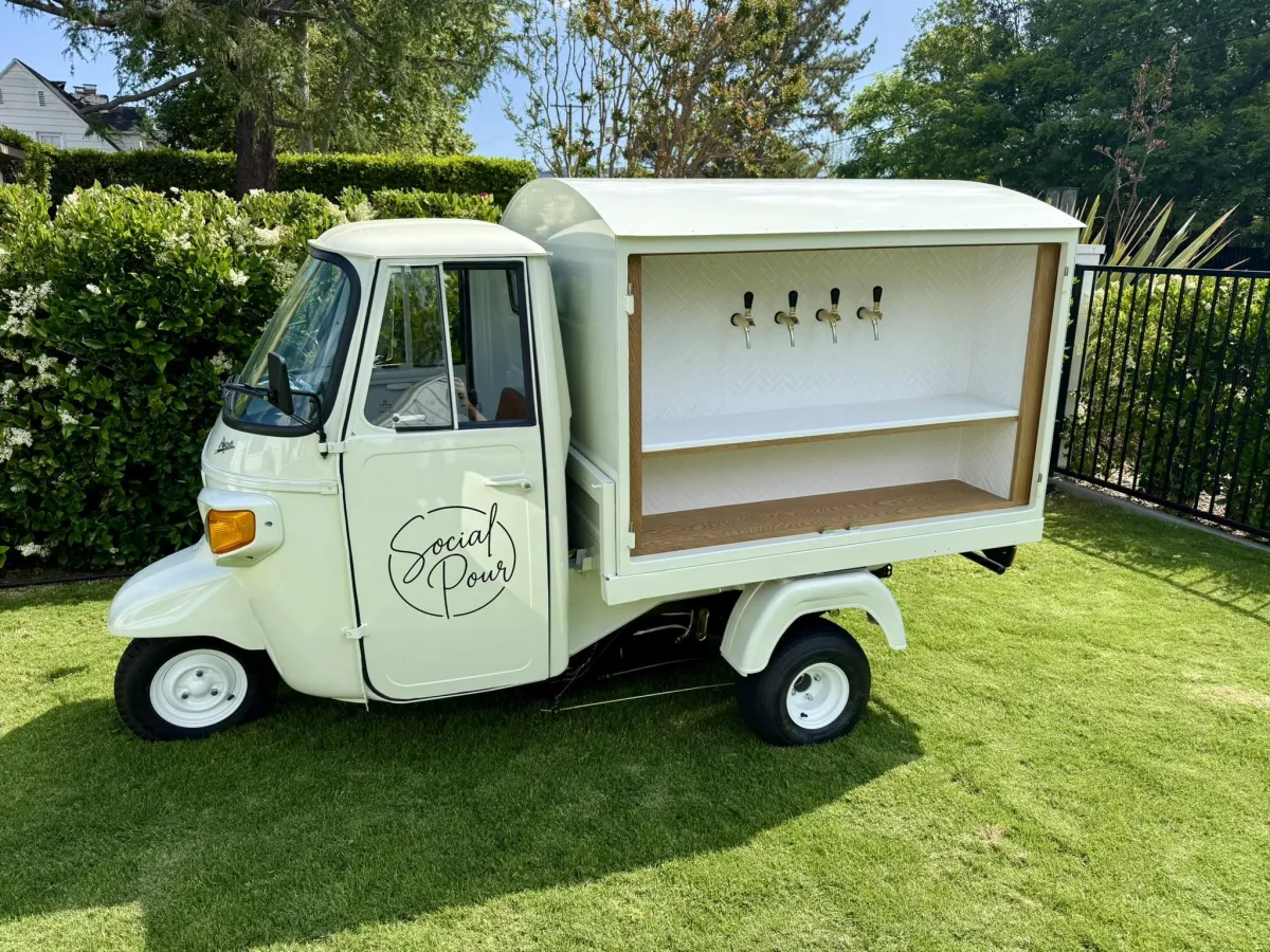 Social Pour Piaggio Ape mobile bar with four taps, available for weddings and corporate events in Los Angeles and Orange County