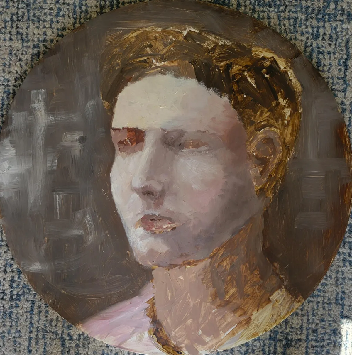 A portrait painting on a round wooden canvas