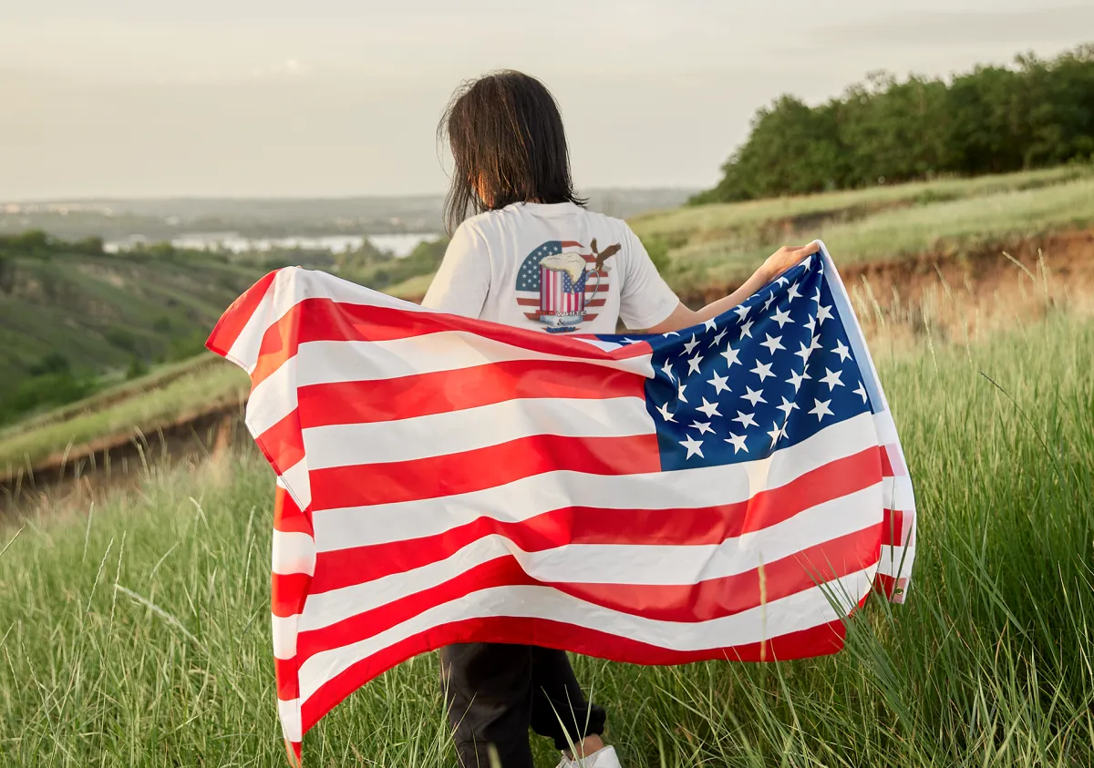 Woman holding an American flag behind her back