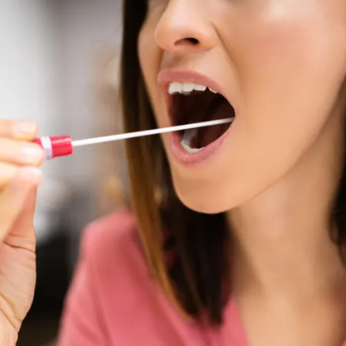 a cat sleeping on top of a black table