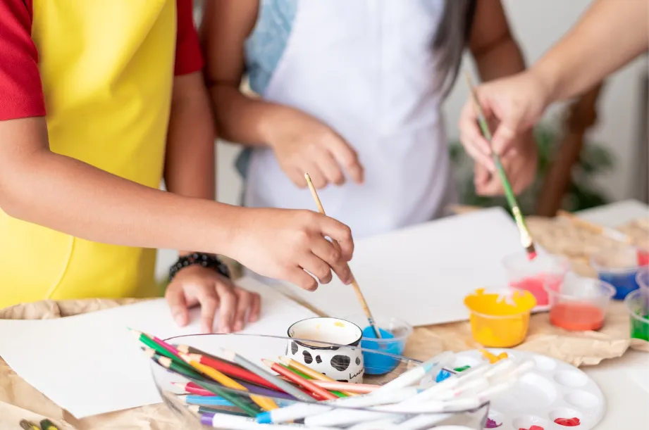 Girl follows directions during arts and crafts time.