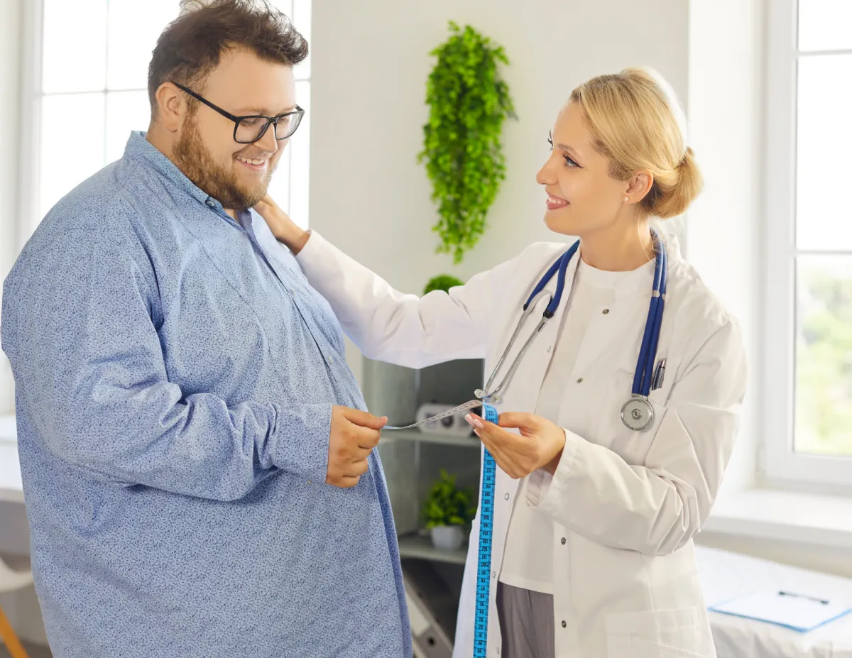 Doctor discussing metabolic syndrome symptoms with a patient at Elite Medical Ocala