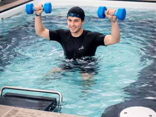 NDIS support worker helping an elderly woman with some of the house chores.