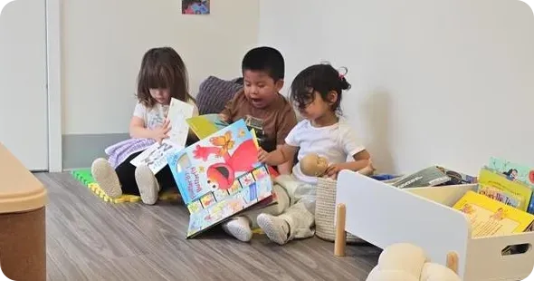 Daycare classroom play activity with toddlers, promoting early childhood development and guided learning