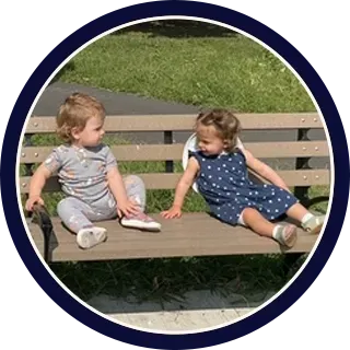 Daycare classroom play activity with toddlers, promoting early childhood development and guided learning