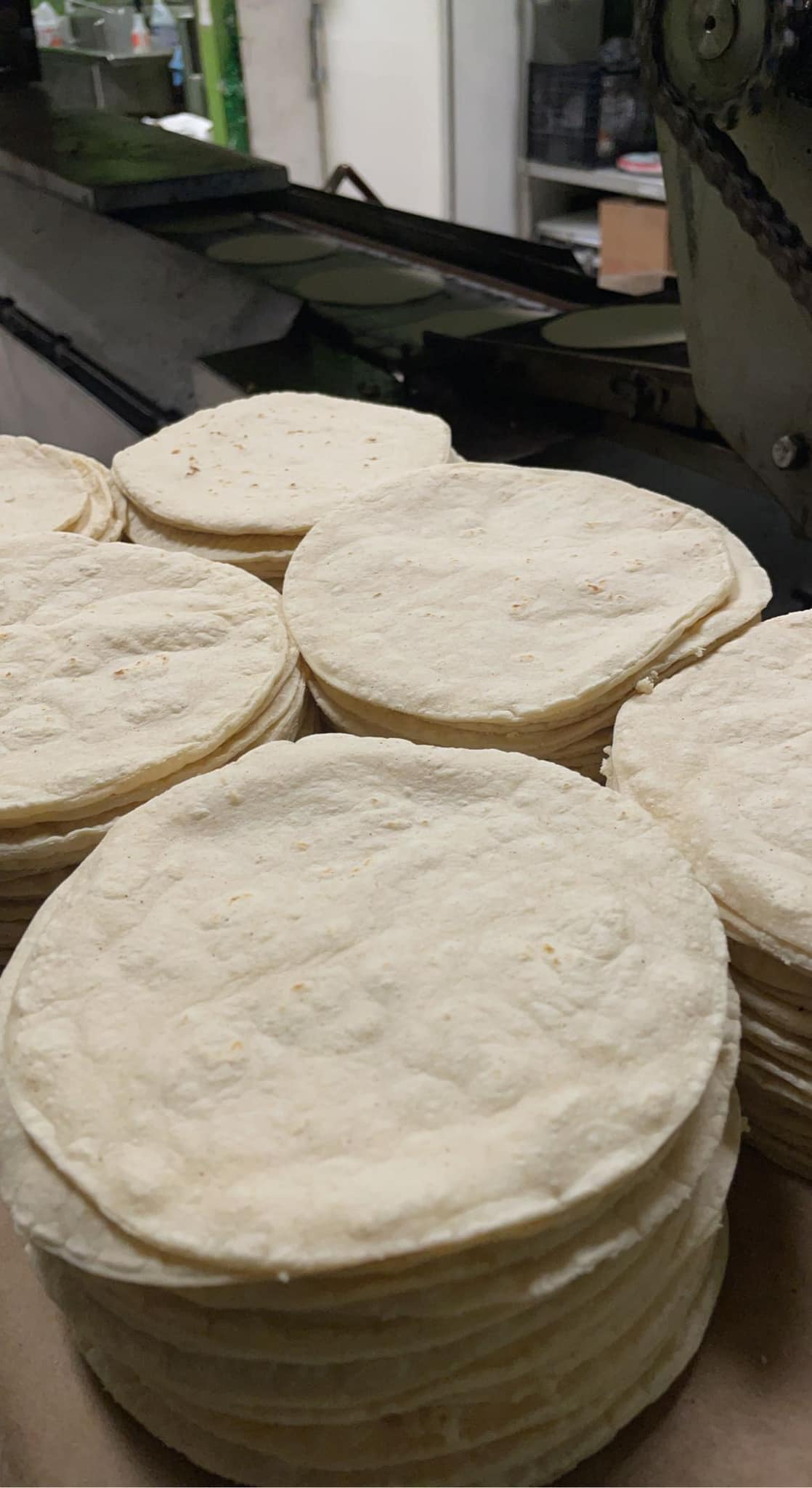 A man is making cookies on a table