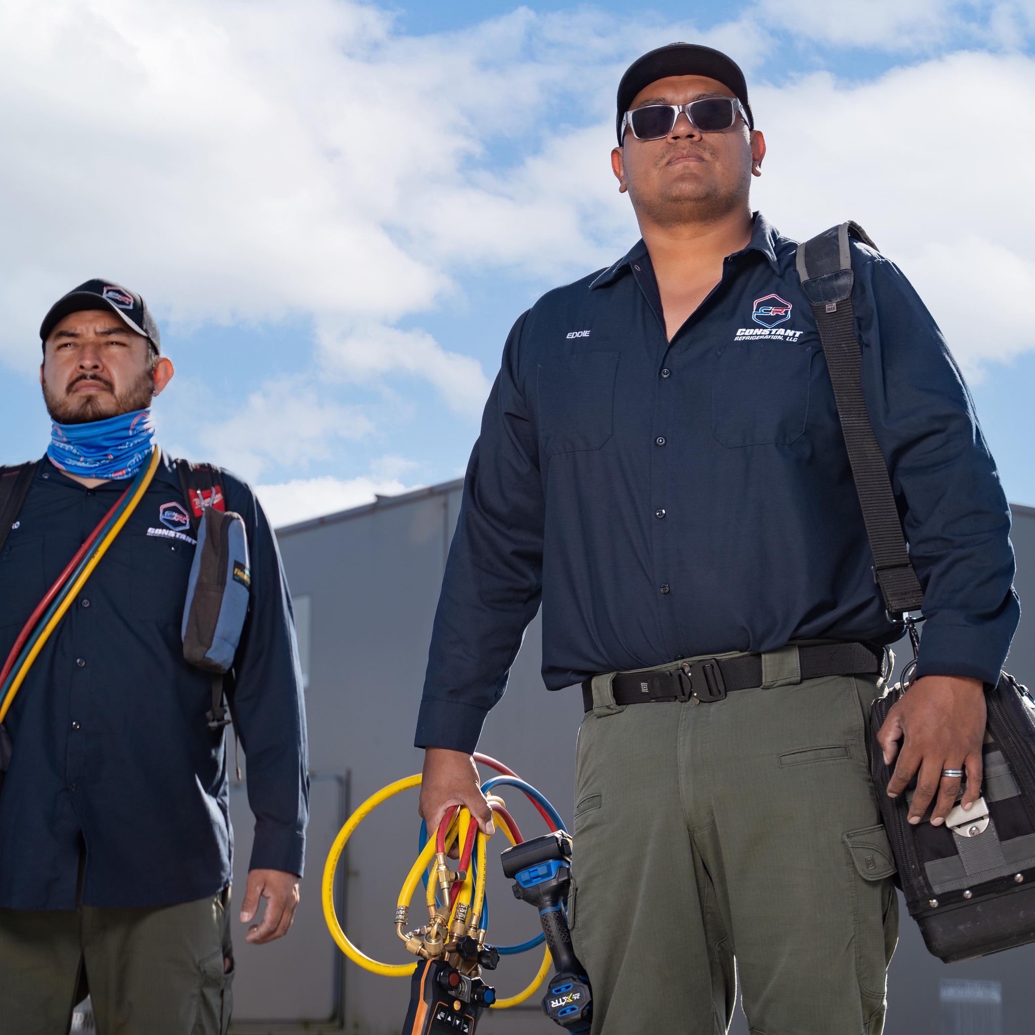 a couple of military radio equipment sitting on top of a wooden table