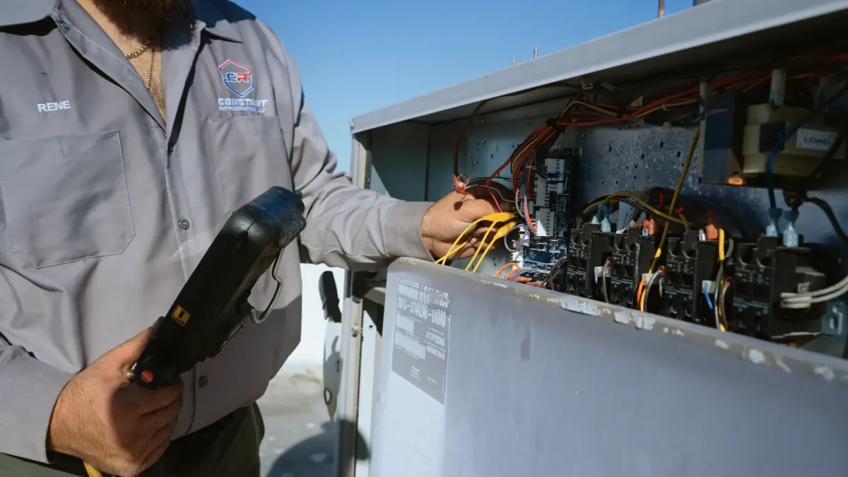 Electric car charger on a concrete wall