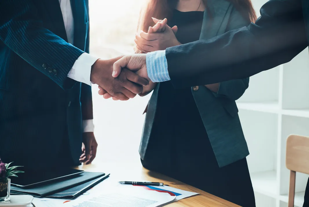 Business Owner shaking hands with employee