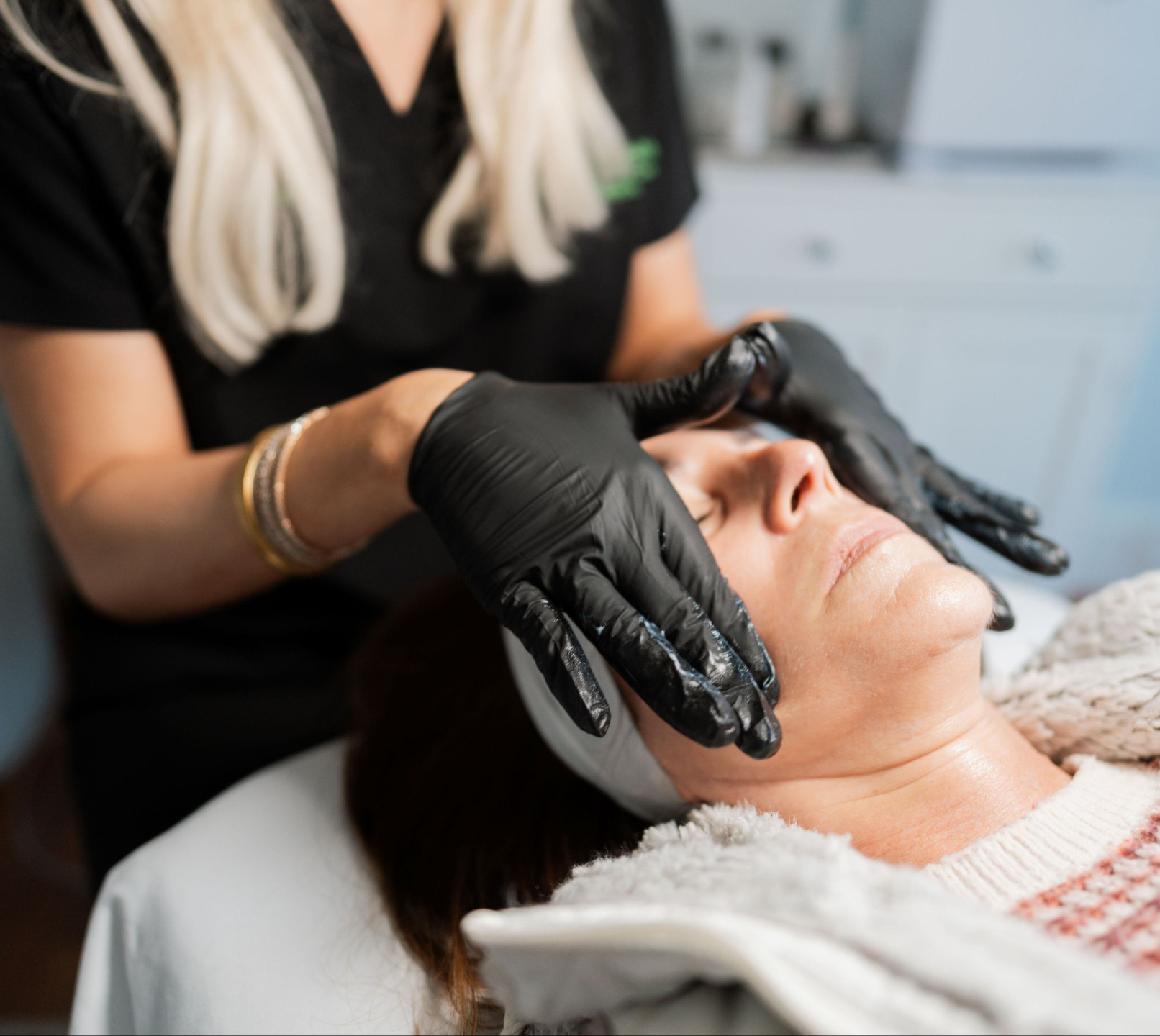 Woman receiving luxury facial treatment