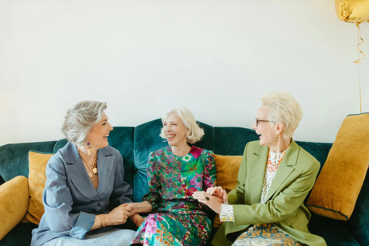 Two women practicing mindfulness meditation indoors, symbolizing calm, emotional balance, and mental well-being during perimenopause and menopause.