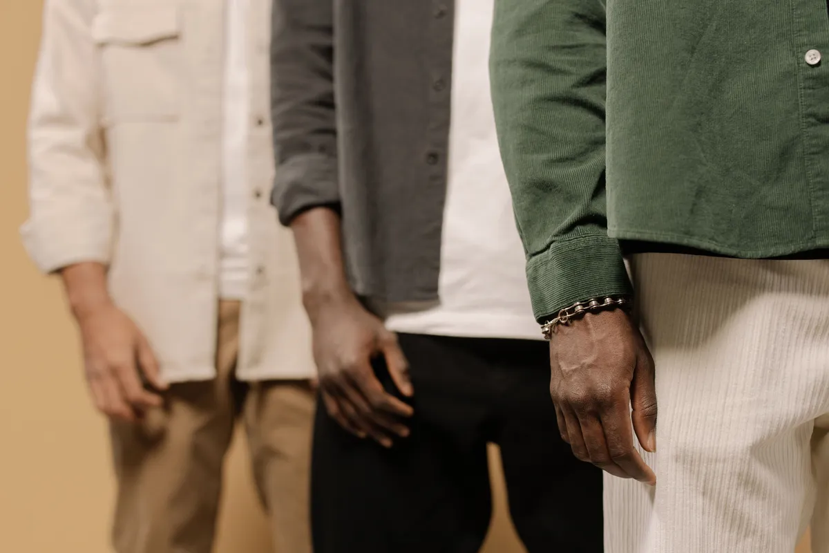 Three men standing together in casual clothing, representing men’s health, confidence, body image, and individualized approaches to penile enhancement.