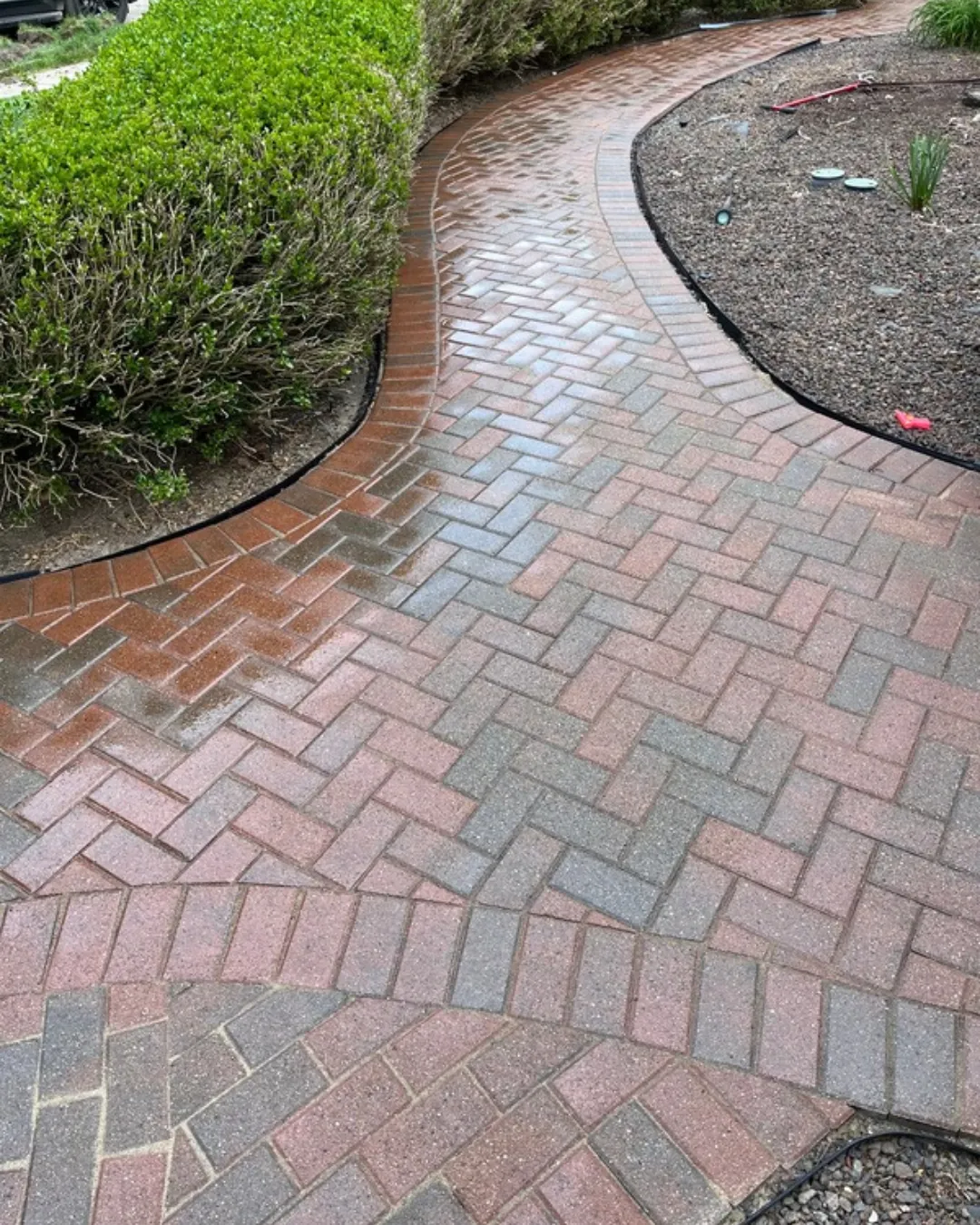 Pressure washing a brick paver walkwayin Macomb County MI