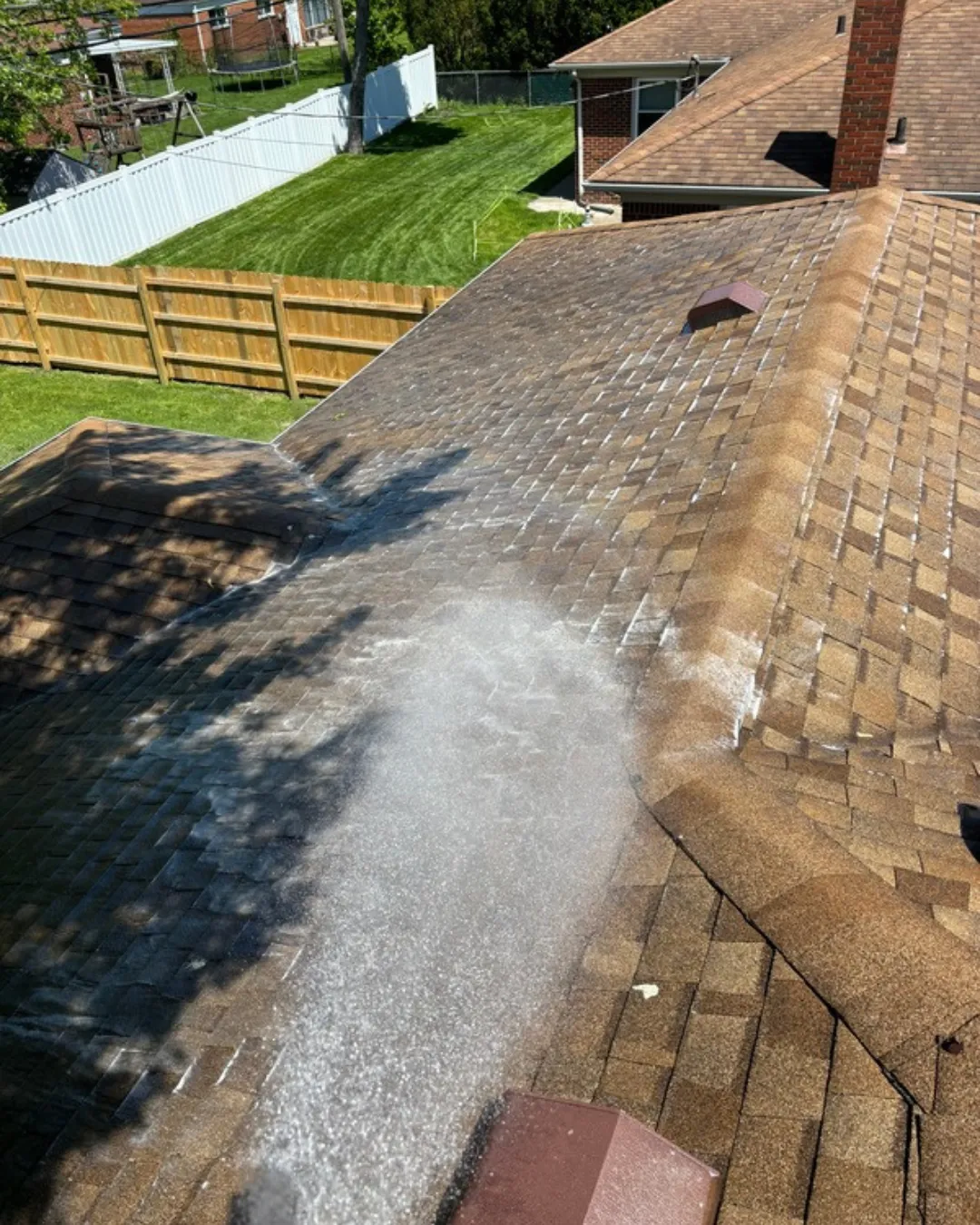Local pressure washing crew cleaning a home exterior in Sterling Heights Michigan