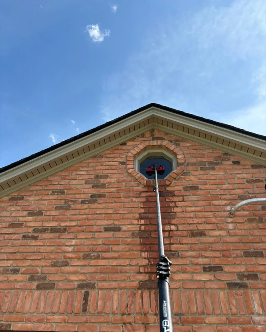 Streak-free window cleaning service on a residential home