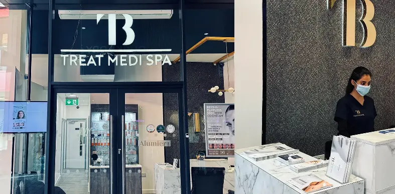 a large yellow building with a pool in front of it