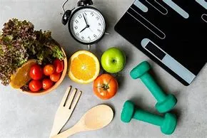 Healthy food, fitness equipment, and a clock, representing a balanced lifestyle and wellness routine.