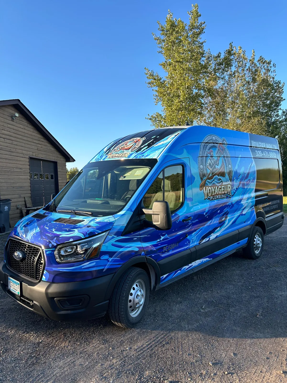 Crew in front of plumbing van